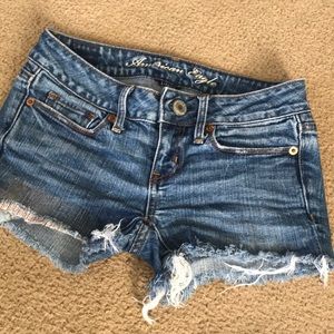 Distressed AE jean shorts